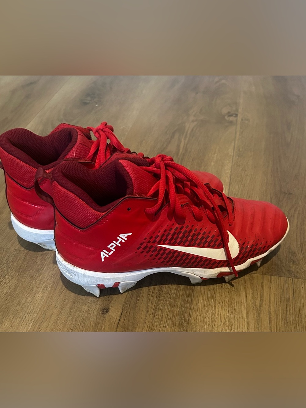 Kids' Red Cleats with White Swoosh